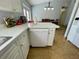 Kitchen island with white dishwasher and speckled countertops at 825 Charles Ave, Orange City, FL 32763