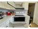 View of the kitchen oven, microwave and countertop at 825 Charles Ave, Orange City, FL 32763