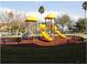 playground with slides and climbing structures at 5479 Vineland Rd # 9201, Orlando, FL 32811