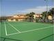 Community tennis court with green surface at 5479 Vineland Rd # 9201, Orlando, FL 32811