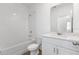 Clean bathroom with white vanity and tiled shower at 4625 Cross Prairie Pkwy, Saint Cloud, FL 34772