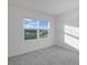 Bright bedroom with gray carpet and large window at 1467 Alston Bay Blvd, Apopka, FL 32703