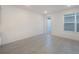 Spacious bedroom with gray tile flooring and access to backyard at 1467 Alston Bay Blvd, Apopka, FL 32703