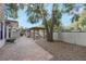 Brick paved patio with pergola and seating area under shade tree at 2019 S Park Ave, Sanford, FL 32771