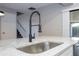 Black gooseneck faucet and modern stainless steel sink at 2920 Pecan Ave, Leesburg, FL 34748