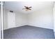Bedroom with ceiling fan and gray carpet flooring at 2920 Pecan Ave, Leesburg, FL 34748