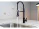 Black gooseneck faucet and modern stainless steel sink at 2920 Pecan Ave, Leesburg, FL 34748