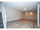 Living room with neutral walls and wood-look flooring at 2920 Pecan Ave, Leesburg, FL 34748