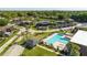 Community swimming pool with lounge chairs and spa at 2920 Pecan Ave, Leesburg, FL 34748