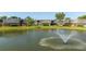 Tranquil pond view with a central fountain feature at 2920 Pecan Ave, Leesburg, FL 34748