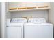 Stackable white washer and dryer in a laundry closet at 2920 Pecan Ave, Leesburg, FL 34748