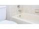 Bathroom with tub and tiled walls at 2920 Pecan Ave, Leesburg, FL 34748