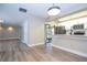 Modern kitchen with white cabinets, granite countertops and stainless steel appliances at 2920 Pecan Ave, Leesburg, FL 34748