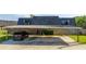 Carport with parking spaces and a black SUV parked under it at 2920 Pecan Ave, Leesburg, FL 34748