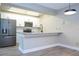 Modern kitchen with stainless steel appliances and granite countertops at 2920 Pecan Ave, Leesburg, FL 34748