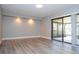 Bright living room with wood-look floors at 2920 Pecan Ave, Leesburg, FL 34748