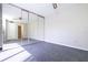 Spacious bedroom with mirrored closet doors and carpet flooring at 2920 Pecan Ave, Leesburg, FL 34748