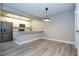 Updated kitchen featuring white shaker cabinets and a breakfast bar at 2920 Pecan Ave, Leesburg, FL 34748