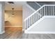 Modern staircase with white railing in a living room at 2920 Pecan Ave, Leesburg, FL 34748