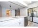 Modern kitchen with white cabinets and granite countertops at 2920 Pecan Ave, Leesburg, FL 34748