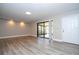 Living room with sliding glass door to patio at 2920 Pecan Ave, Leesburg, FL 34748