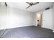 Bedroom with ceiling fan and access to bathroom at 2920 Pecan Ave, Leesburg, FL 34748