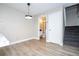 Bright dining area with view into bathroom and stairs at 2920 Pecan Ave, Leesburg, FL 34748