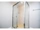 Clean shower with tiled walls and a glass enclosure at 2920 Pecan Ave, Leesburg, FL 34748