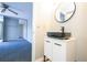 Modern bathroom with black sink and vanity at 2920 Pecan Ave, Leesburg, FL 34748