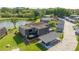 Aerial view of condo unit with private carport and pond view at 2920 Pecan Ave, Leesburg, FL 34748
