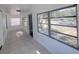 Front porch with tiled floors and multiple windows at 1414 Johns Ave, Haines City, FL 33844