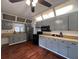 Updated kitchen featuring gray cabinets, wood floors, and modern appliances at 1414 Johns Ave, Haines City, FL 33844