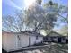 Property features a detached building and a large tree in the backyard at 1414 Johns Ave, Haines City, FL 33844