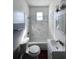 Renovated bathroom with marble tile, bathtub, and updated fixtures at 1414 Johns Ave, Haines City, FL 33844