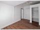 Bright bedroom with hardwood floors and built-in shelving at 1414 Johns Ave, Haines City, FL 33844