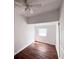 Simple bedroom with hardwood floors and a single window at 1414 Johns Ave, Haines City, FL 33844