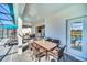 Covered patio with dining furniture and pool view at 4289 Lana Ave, Davenport, FL 33897