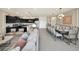 Open concept kitchen and dining area, features granite countertops and modern appliances at 4289 Lana Ave, Davenport, FL 33897