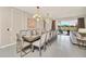 Elegant dining room with seating for 10 and pool access at 4289 Lana Ave, Davenport, FL 33897