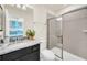 Bathroom with single vanity, granite countertop, and shower at 4289 Lana Ave, Davenport, FL 33897