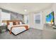 Spacious bedroom with king-size bed, accent wall, and large windows at 4289 Lana Ave, Davenport, FL 33897