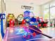 Fun community game room with air hockey and arcade games at 4289 Lana Ave, Davenport, FL 33897