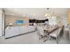 Open concept dining room with seating for 12 at 4289 Lana Ave, Davenport, FL 33897