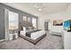 Main bedroom with king-size bed and crib at 4289 Lana Ave, Davenport, FL 33897