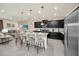 Modern kitchen with stainless steel appliances and island seating at 4289 Lana Ave, Davenport, FL 33897