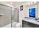 Bathroom with walk-in shower and granite countertop at 4289 Lana Ave, Davenport, FL 33897