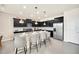 Modern kitchen with stainless steel appliances and island seating at 4289 Lana Ave, Davenport, FL 33897