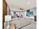 Gathering room with large sectional sofa and wall-mounted TV at 4289 Lana Ave, Davenport, FL 33897