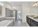 Bathroom with walk-in shower and soaking tub at 4289 Lana Ave, Davenport, FL 33897