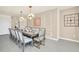 Formal dining room with large table and statement clock at 4289 Lana Ave, Davenport, FL 33897